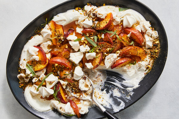 Nectarines on a bed of ricotta cream, dusted with a pistachio dukkah.