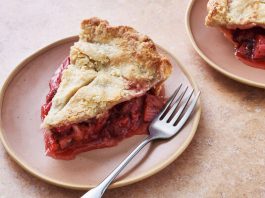 A side image of a slice of pie filled with rhubarb and strawberry.