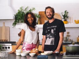 Ayo Edebiri, left, and Ebon Moss-Bachrach at a kitchen counter.