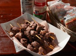 South Dakota’s ‘State Nosh’ Is Meaty and Magnificent Skewers in a paper basket next to Saltine crackers, garlic salt and Greek seasoning.